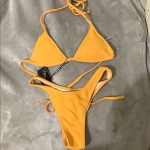 Soft orange triangle thong bathing suit.